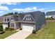 Charming house with stone accents, two car garage and landscaped front lawn at 19004 Dry Narrows Way, Charlotte, NC 28278