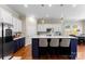 Modern kitchen with stainless steel appliances, island seating, and pendant lighting at 19004 Dry Narrows Way, Charlotte, NC 28278