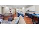 Open-concept living area showcases the hardwood floors and gourmet kitchen at 19004 Dry Narrows Way, Charlotte, NC 28278