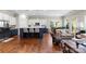 Bright living room open to the kitchen featuring hardwood floors and modern finishes at 19004 Dry Narrows Way, Charlotte, NC 28278