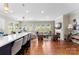 Open-concept living space with fireplace, hardwood floors, and abundant natural light at 19004 Dry Narrows Way, Charlotte, NC 28278