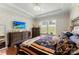 Spacious main bedroom features a trey ceiling, chandelier, hardwood floors, and a large dresser at 19004 Dry Narrows Way, Charlotte, NC 28278