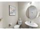 Powder room featuring a toilet and a sink with modern fixtures and decor at 19004 Dry Narrows Way, Charlotte, NC 28278