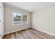 Bright bedroom with laminate flooring and a large window with natural light at 2009 Auten Rd, Gastonia, NC 28054