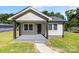 Charming single-story home with a covered front porch, neutral siding and walkway at 2009 Auten Rd, Gastonia, NC 28054
