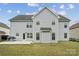 Back exterior of home with a grassy yard and a patio area at 2028 Covered Bridge Ct, Rock Hill, SC 29732