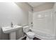 This bathroom includes a shower and tub combination and a pedestal sink at 2028 Covered Bridge Ct, Rock Hill, SC 29732