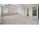 Spacious main bedroom with tray ceilings, a ceiling fan, and multiple windows at 2028 Covered Bridge Ct, Rock Hill, SC 29732