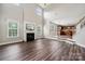 Living room with high ceilings, a fireplace, hardwood floors, and views of the kitchen at 2028 Covered Bridge Ct, Rock Hill, SC 29732