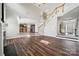 Open concept living area with hardwood floors, a staircase, and a view into the kitchen at 2028 Covered Bridge Ct, Rock Hill, SC 29732