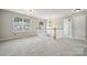 Open loft area with white railing, neutral carpet and trim, and multiple windows at 2028 Covered Bridge Ct, Rock Hill, SC 29732