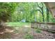 Expansive backyard with a deck and wooded surroundings at 205 E Cleveland Ave, Bessemer City, NC 28016