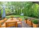 Private backyard deck with seating and lush greenery, perfect for outdoor entertaining at 205 E Cleveland Ave, Bessemer City, NC 28016