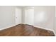 Neutral-colored bedroom with hardwood floors, white trim, and a closet at 205 E Cleveland Ave, Bessemer City, NC 28016