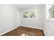 Cozy bedroom with hardwood floors and natural light from two windows at 205 E Cleveland Ave, Bessemer City, NC 28016
