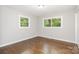 Bright bedroom with hardwood floors and windows offering natural light at 205 E Cleveland Ave, Bessemer City, NC 28016