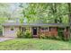 Charming one-story home featuring a classic brick facade and lovely landscaping at 205 E Cleveland Ave, Bessemer City, NC 28016