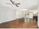 Open floor plan features hardwood floors and a bright kitchen with stainless appliances at 205 E Cleveland Ave, Bessemer City, NC 28016