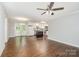 Open floor plan features hardwood floors and a bright kitchen with stainless appliances at 205 E Cleveland Ave, Bessemer City, NC 28016
