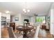 Cozy living room and dining room featuring hardwood floors and plenty of natural light at 205 E Cleveland Ave, Bessemer City, NC 28016