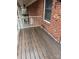 Step onto this covered balcony with wood-look floors from this beautiful brick apartment at 2106 S Main St, Kannapolis, NC 28081
