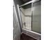 Clean bathroom equipped with a shower-tub combo featuring glass sliding door at 2106 S Main St, Kannapolis, NC 28081