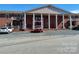 Apartment building featuring a stately facade with brick and prominent columns, complemented by a spacious parking area at 2106 S Main St, Kannapolis, NC 28081