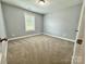 Neutral bedroom featuring carpet floors and natural light from the window at 212 Old Centergrove Rd, Kannapolis, NC 28083
