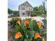 Lovely two-story home with vibrant flowerbeds and landscaped front yard, adding curb appeal at 212 Old Centergrove Rd, Kannapolis, NC 28083