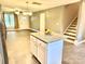 Open concept kitchen flowing into living area, featuring an island with granite countertops at 212 Old Centergrove Rd, Kannapolis, NC 28083