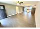 Spacious open-concept living room with wood-look flooring connecting to the kitchen and dining area at 212 Old Centergrove Rd, Kannapolis, NC 28083