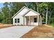 Charming single-story home with white siding and a cozy front porch at 217 E Division Ave, Salisbury, NC 28144