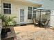 Cozy patio with outdoor seating under an umbrella, perfect for relaxing and enjoying outdoor dining at 228 Dawn Mist Ln, Fort Mill, SC 29708