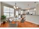 Bright dining area with a modern table, stylish chairs, and seamless transition to the kitchen at 228 Dawn Mist Ln, Fort Mill, SC 29708