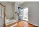 Bright foyer with hardwood floors and a staircase with carpeted steps at 228 Dawn Mist Ln, Fort Mill, SC 29708