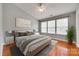 Serene main bedroom with neutral colors, ample natural light, and a comfortable seating area at 228 Dawn Mist Ln, Fort Mill, SC 29708