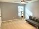 Clean bedroom with a couch, neutral carpet and a cat tree near the window at 2311 Verde Creek Rd, Charlotte, NC 28214