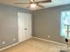 Simple bedroom with double door closet and window for natural light at 2311 Verde Creek Rd, Charlotte, NC 28214