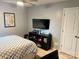 Cozy bedroom featuring a ceiling fan, a television and a door to the closet at 2311 Verde Creek Rd, Charlotte, NC 28214