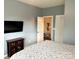 Bedroom featuring a TV, closet access, and ceiling fan at 2311 Verde Creek Rd, Charlotte, NC 28214