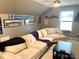 This bonus room features fan decor, a large sectional couch and a view of the window at 2311 Verde Creek Rd, Charlotte, NC 28214