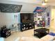 Spacious bonus room with fan decor and a large television and comfortable seating at 2311 Verde Creek Rd, Charlotte, NC 28214