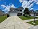 Beautiful home with a two-car garage, well-manicured lawn, and a classic design at 2311 Verde Creek Rd, Charlotte, NC 28214