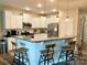 Bright kitchen featuring white cabinets, granite countertops, stainless steel appliances and breakfast bar at 2311 Verde Creek Rd, Charlotte, NC 28214
