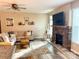 Inviting living room with stylish decor, stone fireplace, comfortable seating, and ample natural light at 2311 Verde Creek Rd, Charlotte, NC 28214
