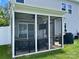 Screened porch featuring outdoor seating, a ceiling fan, and a grill at 2311 Verde Creek Rd, Charlotte, NC 28214