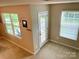 Room with 2 windows and a door to the outside at 2311 Verde Creek Rd, Charlotte, NC 28214