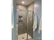 A large, tiled shower stall with a glass enclosure and built-in shelving at 2311 Verde Creek Rd, Charlotte, NC 28214