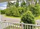 View of neighborhood from the porch of the property with greenery and trees at 2311 Verde Creek Rd, Charlotte, NC 28214