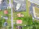 Aerial view of multiple properties with tree-lined walkable streets near retail businesses at 3 Circle Dr, Lincolnton, NC 28092